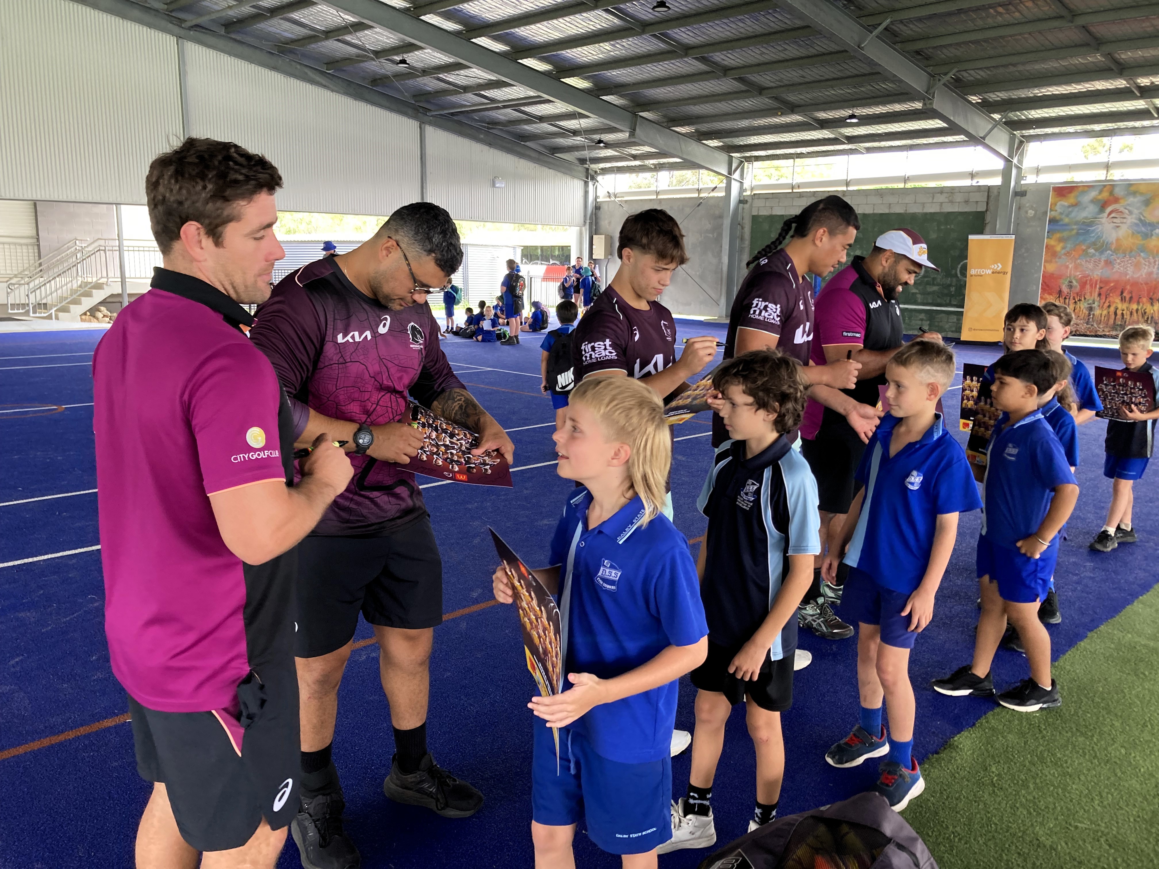 Brisbane Broncos signing autographs at Dalby State School.